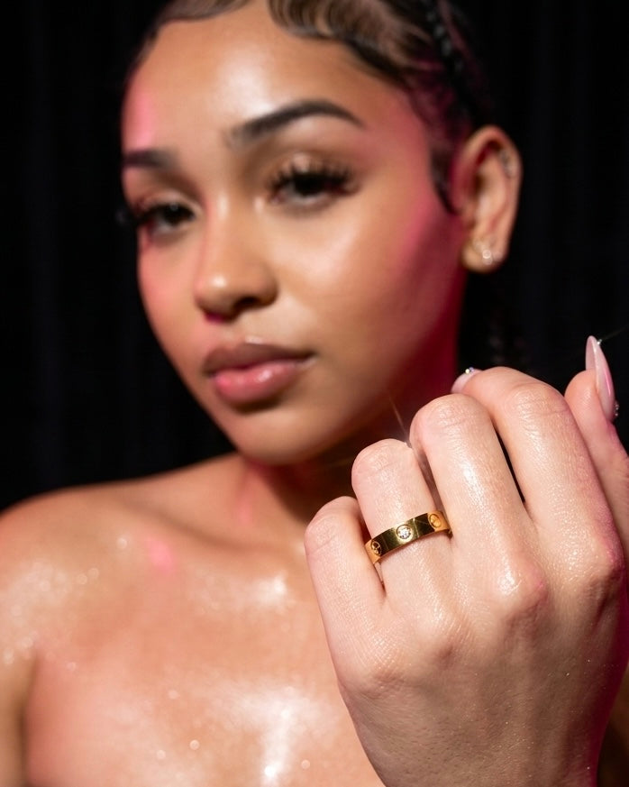 Model wearing 18k gold filled screw band ring